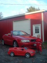 My son Grant showing of the Father and Son C70 cars infront of the Volvo Speed Shop