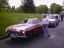 My lovely wife Heather next to a P 1800 S, it is now her favorite "Old" car.  The building just off her left shoulder is IPd, you can see all the Volvos parked on NE Ainsworth Cir.