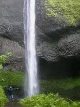 That's Heather getting soaked by the Oregon rain at the base of the Latourell Falls just off Route 14.